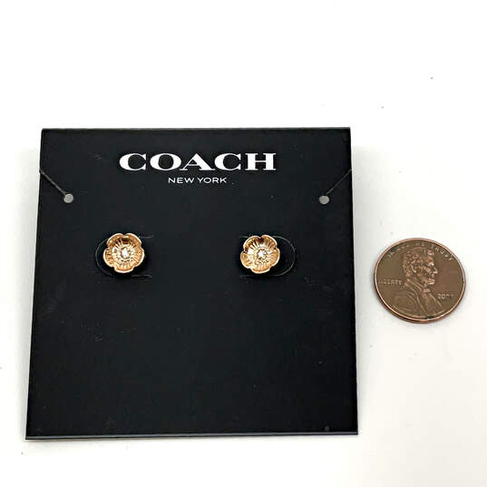 Designer Coach Gold-Tone Flower Shape Crystal Cut Stone Stud Earrings image number 2