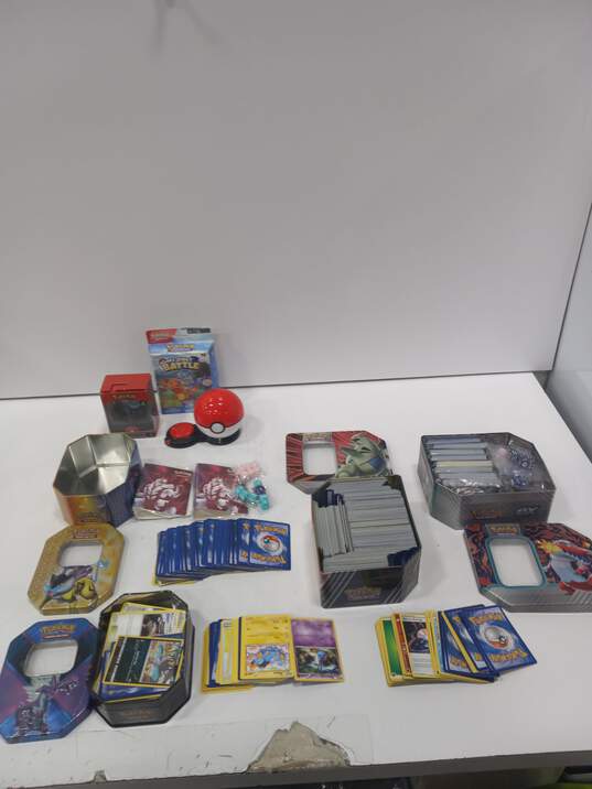 9.1lbs Bundle of Assorted of Pokemon Cards In Tins & Other Merchandise image number 1