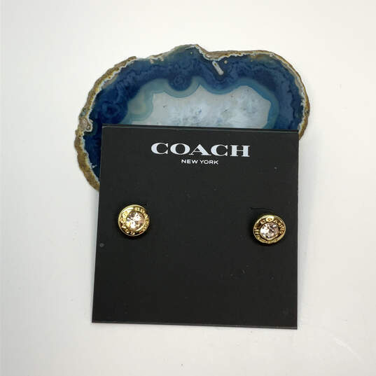 Designer Coach Gold-Tone Open Circle Clear Crystal Push Lock Stud Earrings image number 1