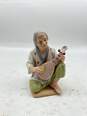 Man With Musical Instrument Figurine image number 1