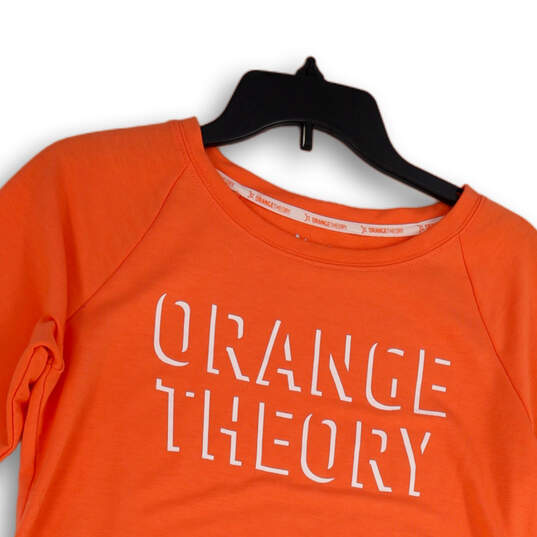 Buy the NWT Womens Orange Theory Spell Out Front Tie Pullover T
