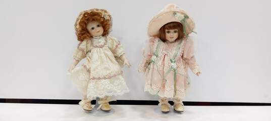 Pair of Franklin Mint Porcelain Dolls w/Stands image number 1