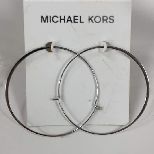 Buy the Designer Michael Kors Silver Tone Plated Whisper Hoop Earrings |  GoodwillFinds