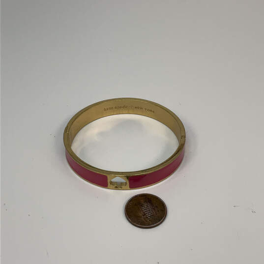 Designer Kate Spade Gold-Tone Pink Enamel Round Hinged Bangle Bracelet image number 3