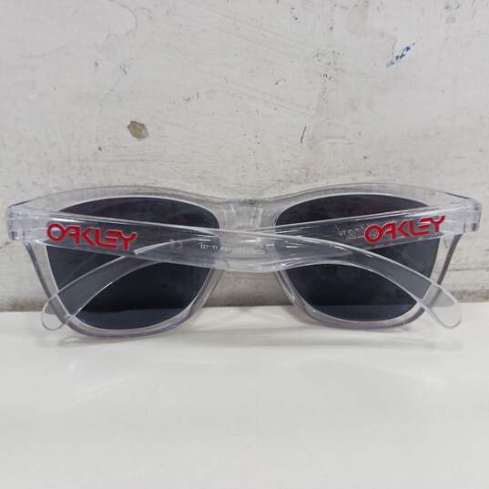 Clear Oakley Sunglasses Frames w/ Transparent Red Lenses image number 2