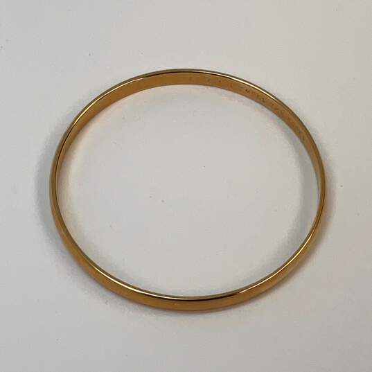 Designer Kate Spade Gold-Tone Engraved Round Bangle Bracelet image number 2