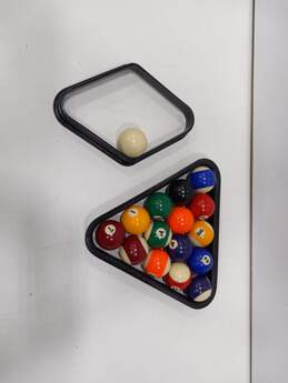 SET OF POOL BALLS AND 2 TYPES OF RACKS Q BALL IS CHIPPED