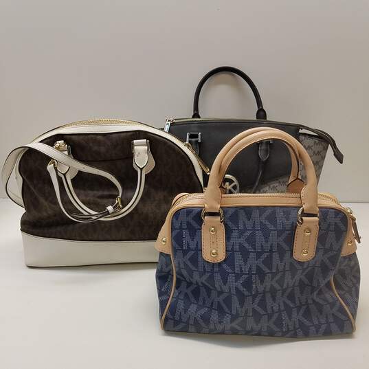 Lot - Three ladies leather handbags: One copy of Louis Vuitton
