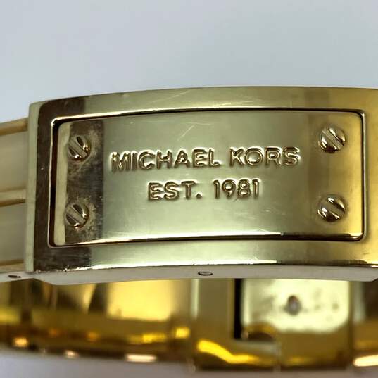 Designer Michael Kors Gold Tone Heritage Logo Hinged Bangle Bracelet image number 4