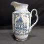 White and Blue Ceramic Pitcher w/Gold Tone Trim image number 1