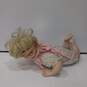 Porcelain Baby Girl Doll with Blonde Hair image number 1