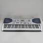 Gray Casio Electric Keyboard image number 1