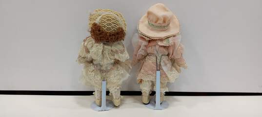 Pair of Franklin Mint Porcelain Dolls w/Stands image number 2