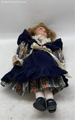 Collectible Porcelain Doll In Blue Dress