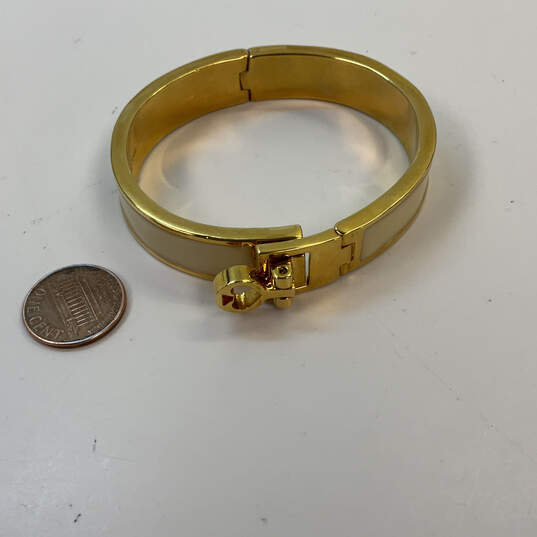 Designer Kate Spade New York Gold-Tone Fold Over Clasp Bangle Bracelet image number 3
