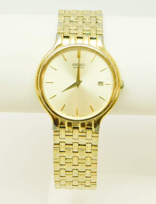 Buy the Vintage 7N29-6411 Gold Tone Steel Calendar Mens Dress Watch | GoodwillFinds