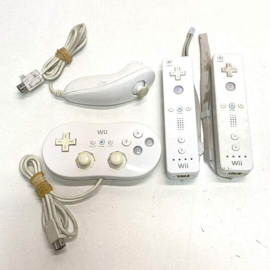 Nintendo Wii Remotes & Accessories Lot of 4 image number 1