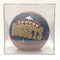Encased Team Signed Denver Nuggets Basketball from the Early 90s image number 1