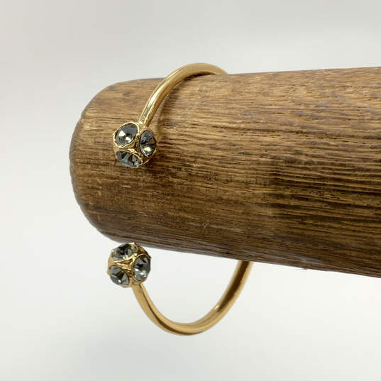 Designer Kate Spade Gold-Tone Crystal Stone Hinged Open Cuff Bracelet image number 1