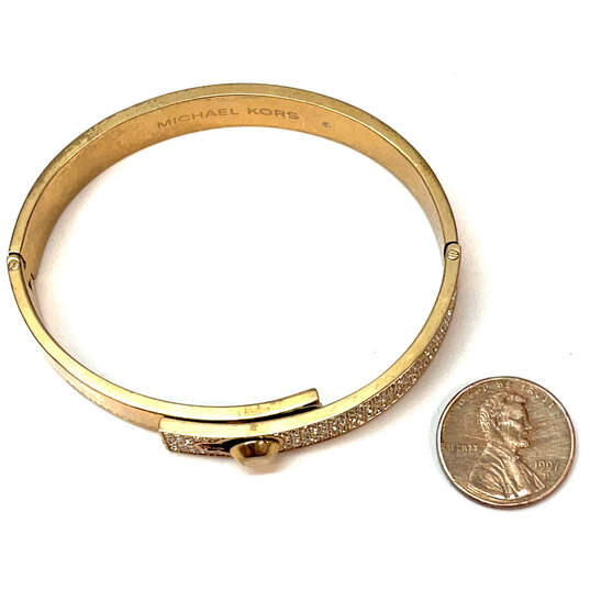 Designer Michael Kors Gold-Tone Rhinestone Hinged Round Bangle Bracelet image number 2