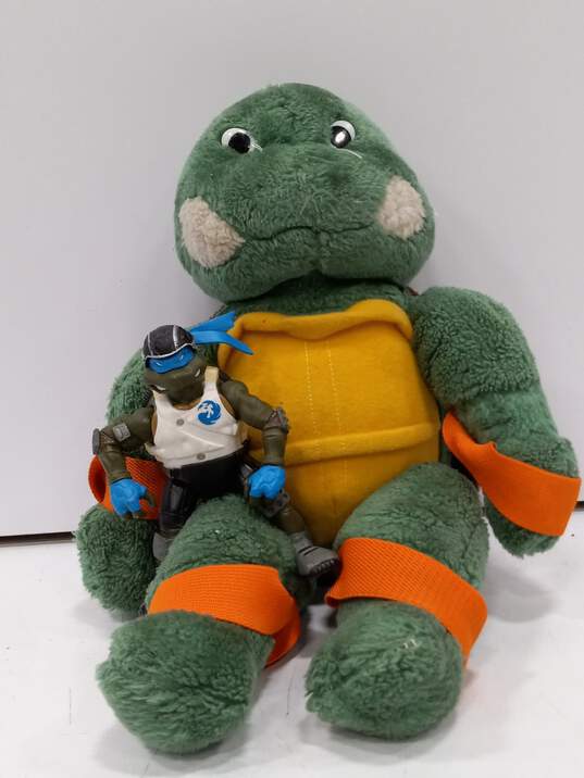 Bundle of 3 Ninja Turtle Items: Stuffed Animal, Bag, And Action Figure image number 2