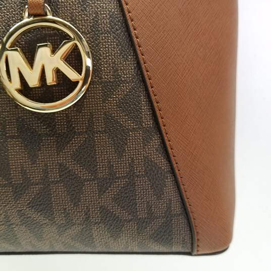 Buy the Michael Kors Brown Signature Monogram Mini Tote Bag