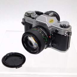 Canon AE-1 35mm SLR Film Camera w/ 2 Lenses Flash Manuals & Case alternative image