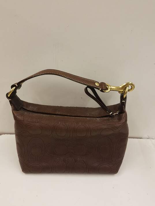 Coach Leather Embossed Monogram Mini Handbag Brown