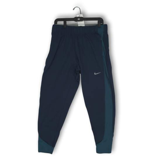 NWT Nike Womens Joggers Pants Tapered Leg Zipper Pockets Pull On Blue Size Large image number 1