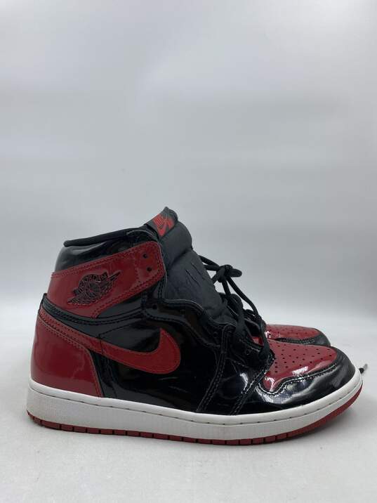 Nike Air Jordan 1 Red Athletic Shoe Men 8.5 image number 1