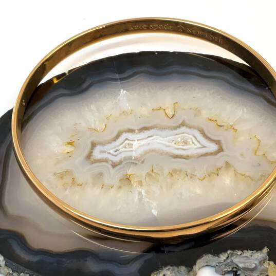 Designer Kate Spade Gold-Tone Engraved Round Bangle Bracelet image number 3