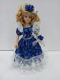 Porcelain Doll of Girl In Blue Dress In Box image number 2