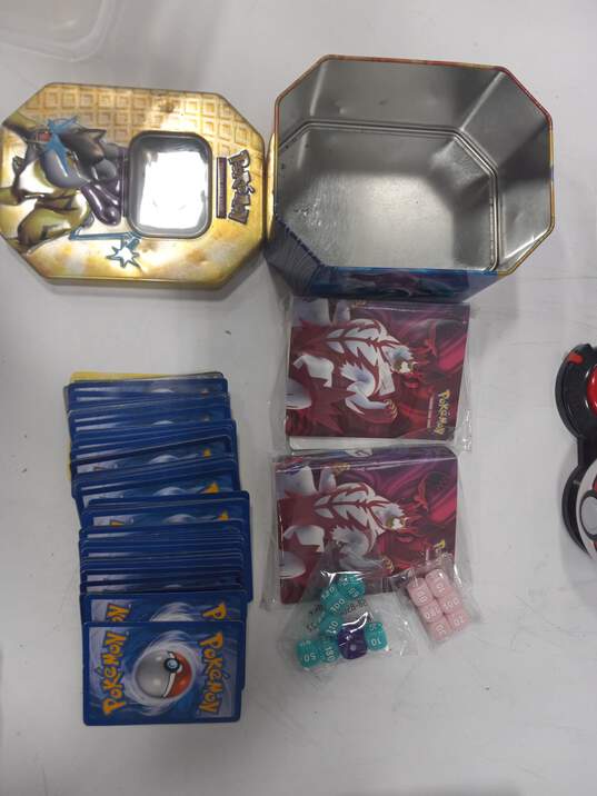9.1lbs Bundle of Assorted of Pokemon Cards In Tins & Other Merchandise image number 3