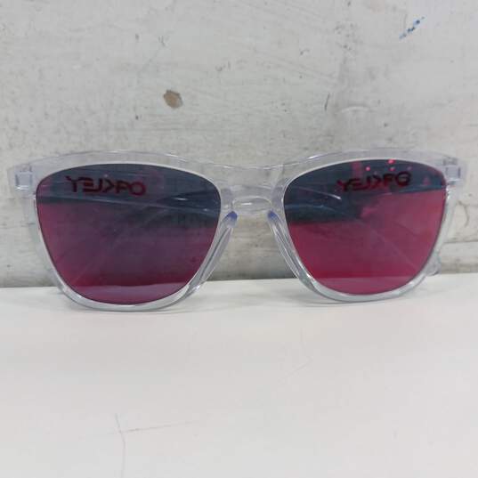 Clear Oakley Sunglasses Frames w/ Transparent Red Lenses image number 1