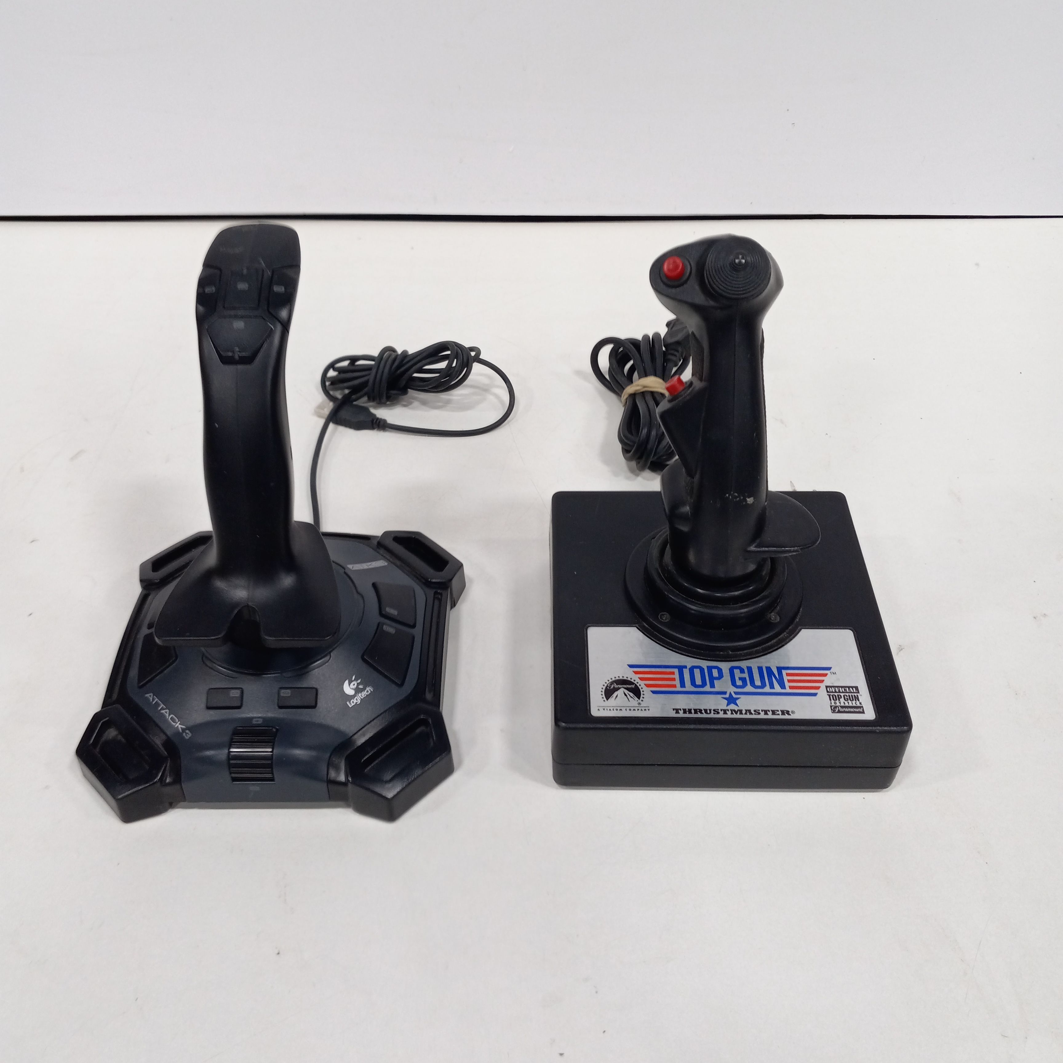 Buy the Pair Of Logitech Attack 3 PC/Mac & Thrustmaster Top Gun Joysticks |  GoodwillFinds