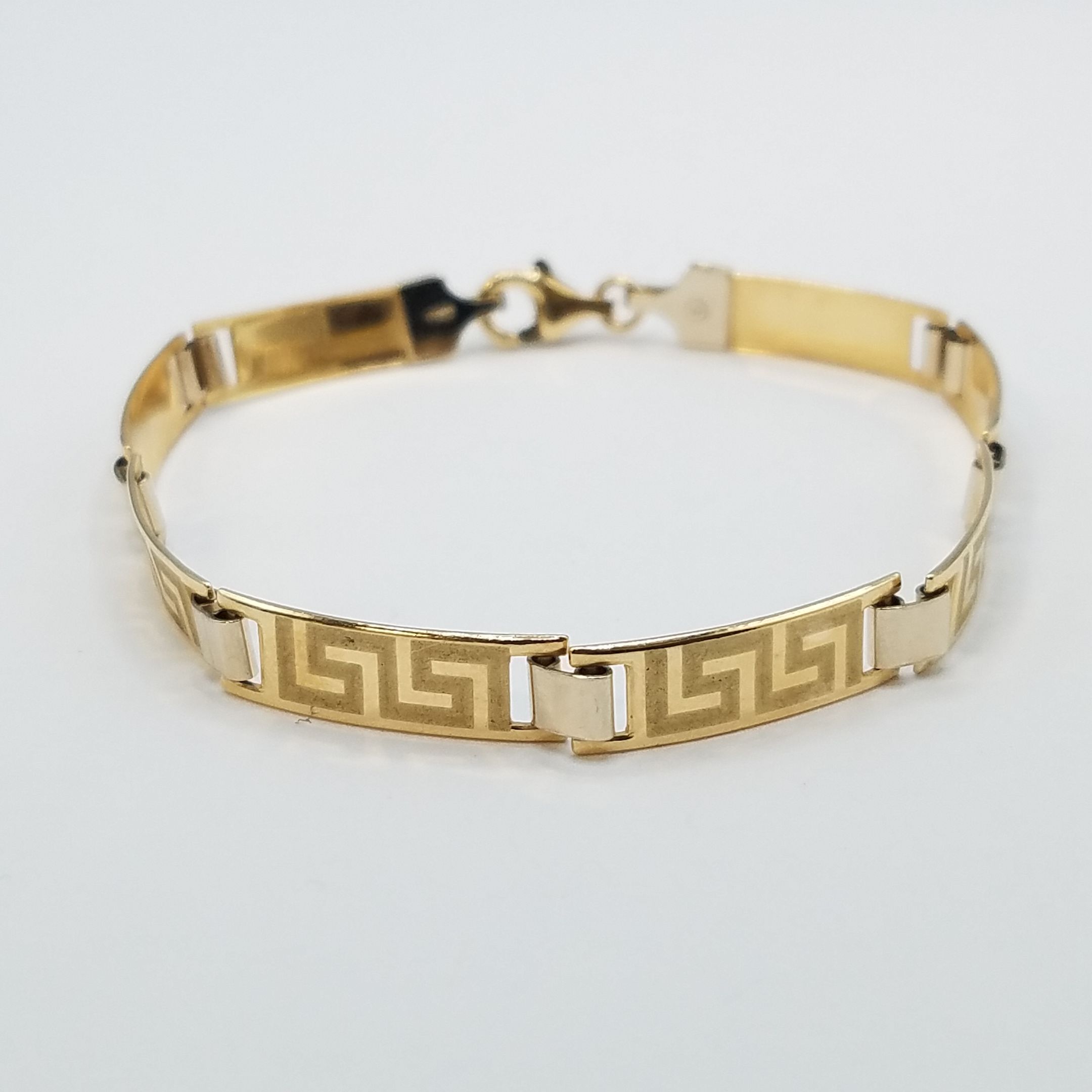 An Italian gold Greek key pattern link bracelet stamped 585, 9.5g  Location:CAB1