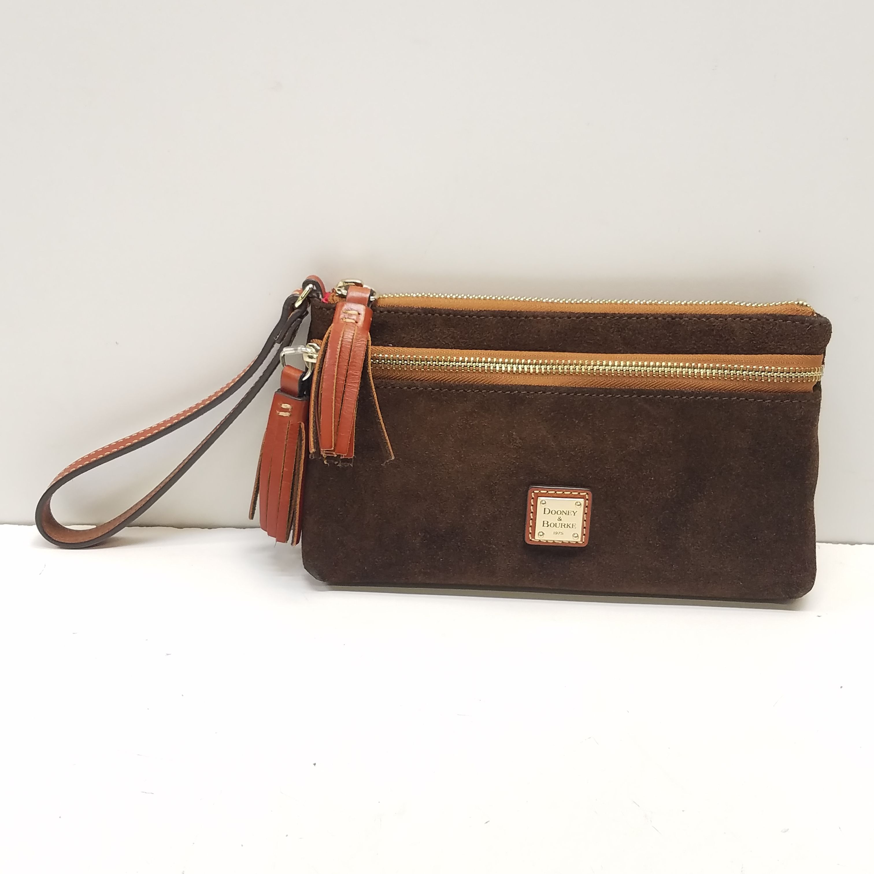 Buy the Dooney Bourke Brown Suede Double Zip Tassel Wristlet