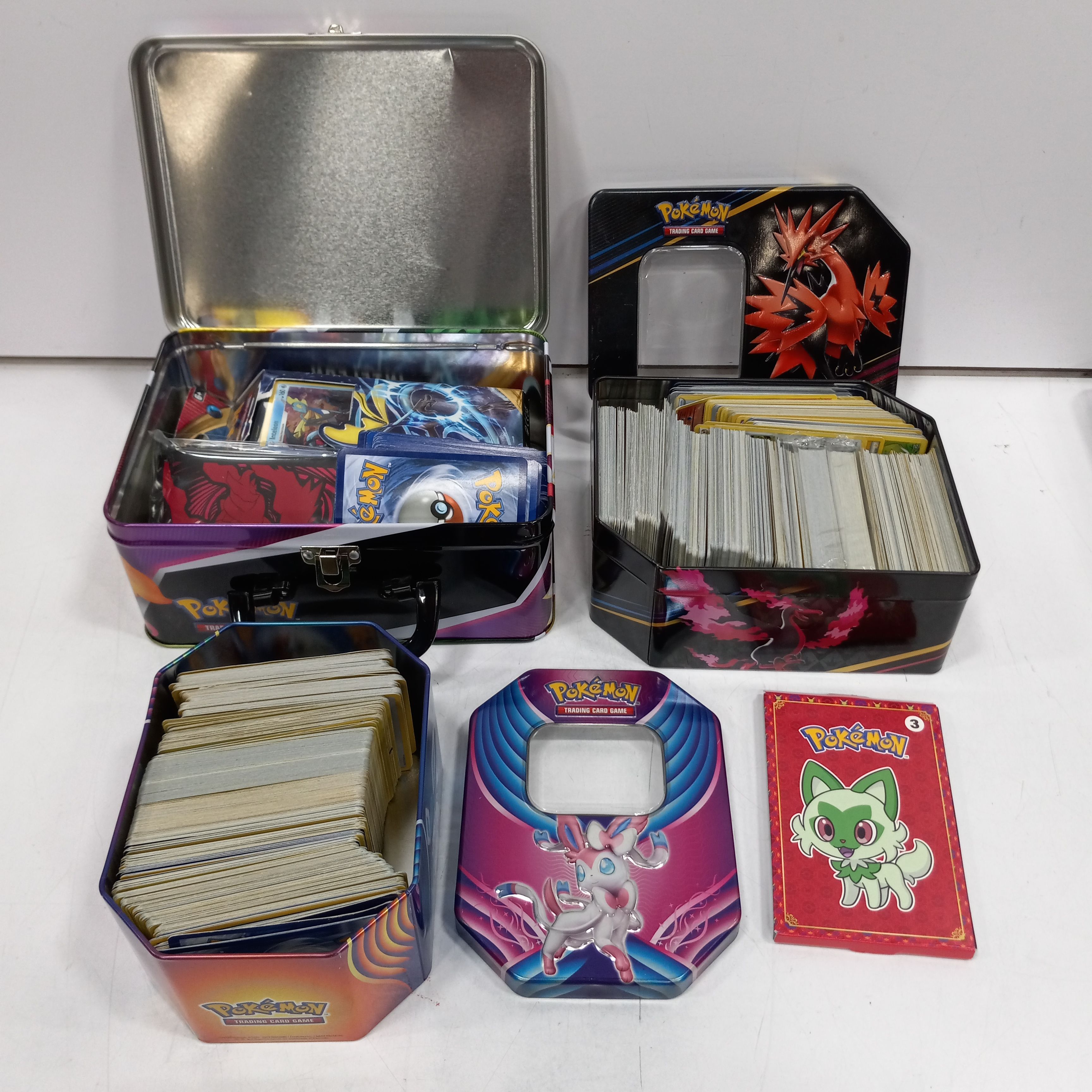 Buy Pokemon Cards in 3 Metal Boxes for USD 150.00 | GoodwillFinds