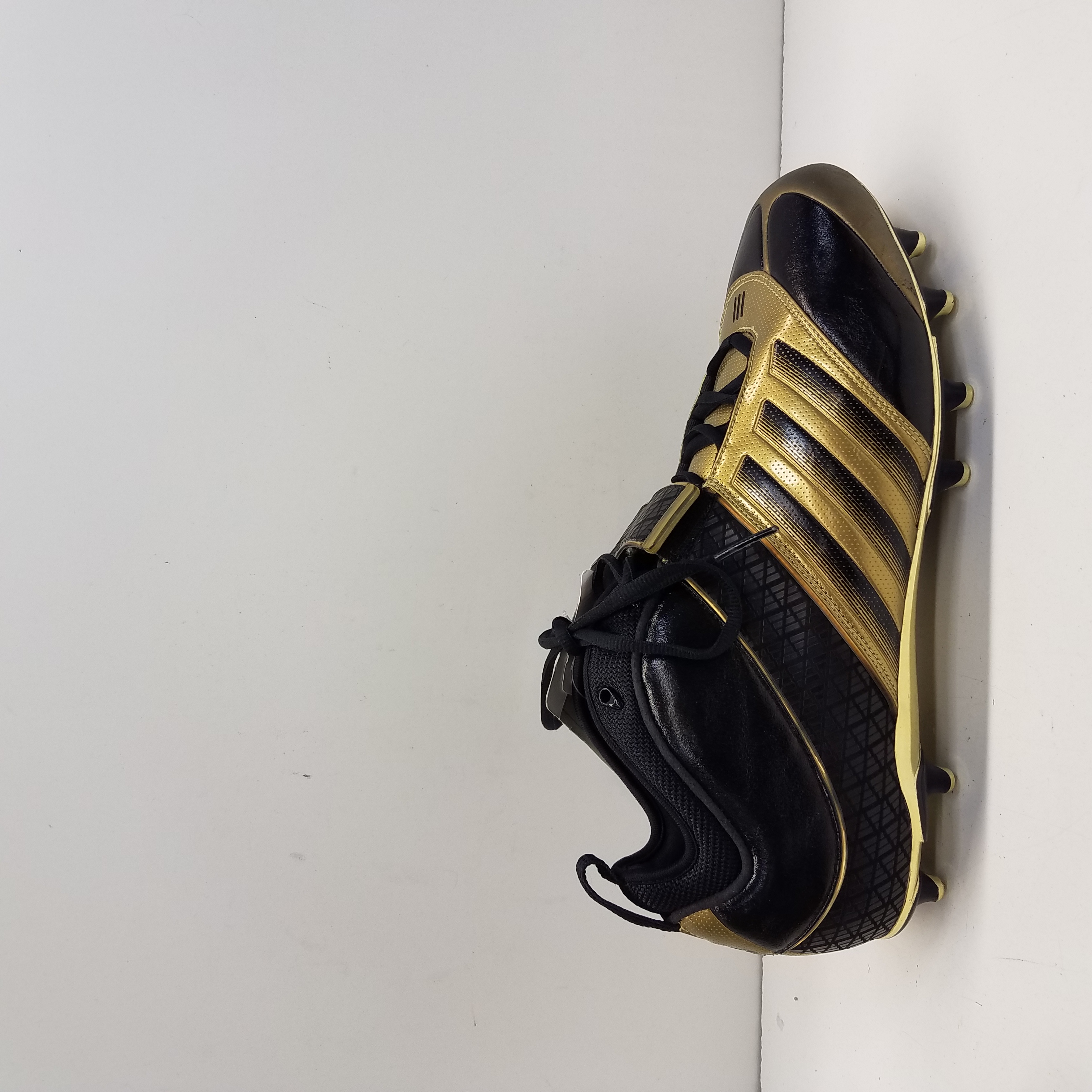 black and gold adidas cleats