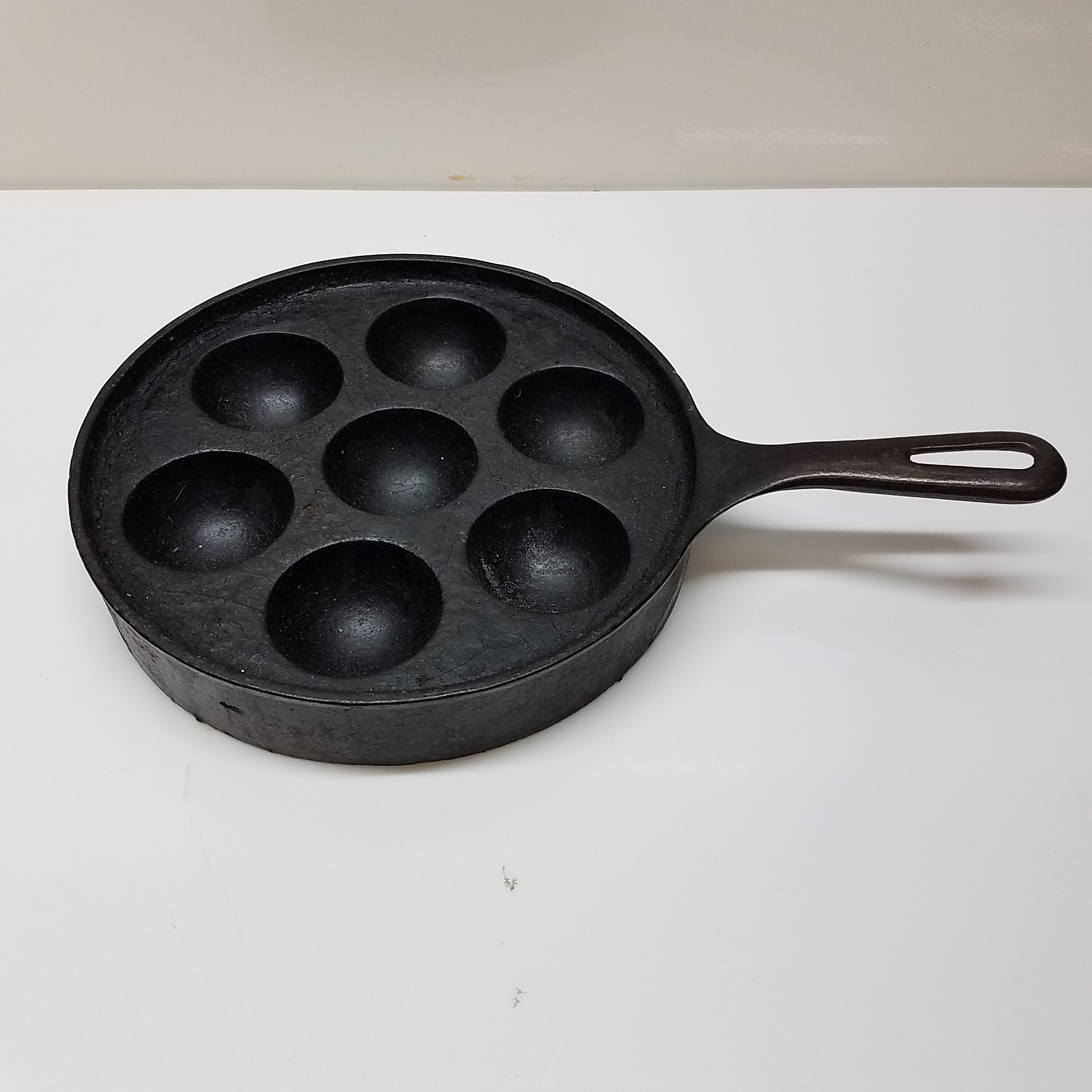 Buy the Vintage 962 Cast Iron Aebleskiver Egg Poacher Pan | GoodwillFinds