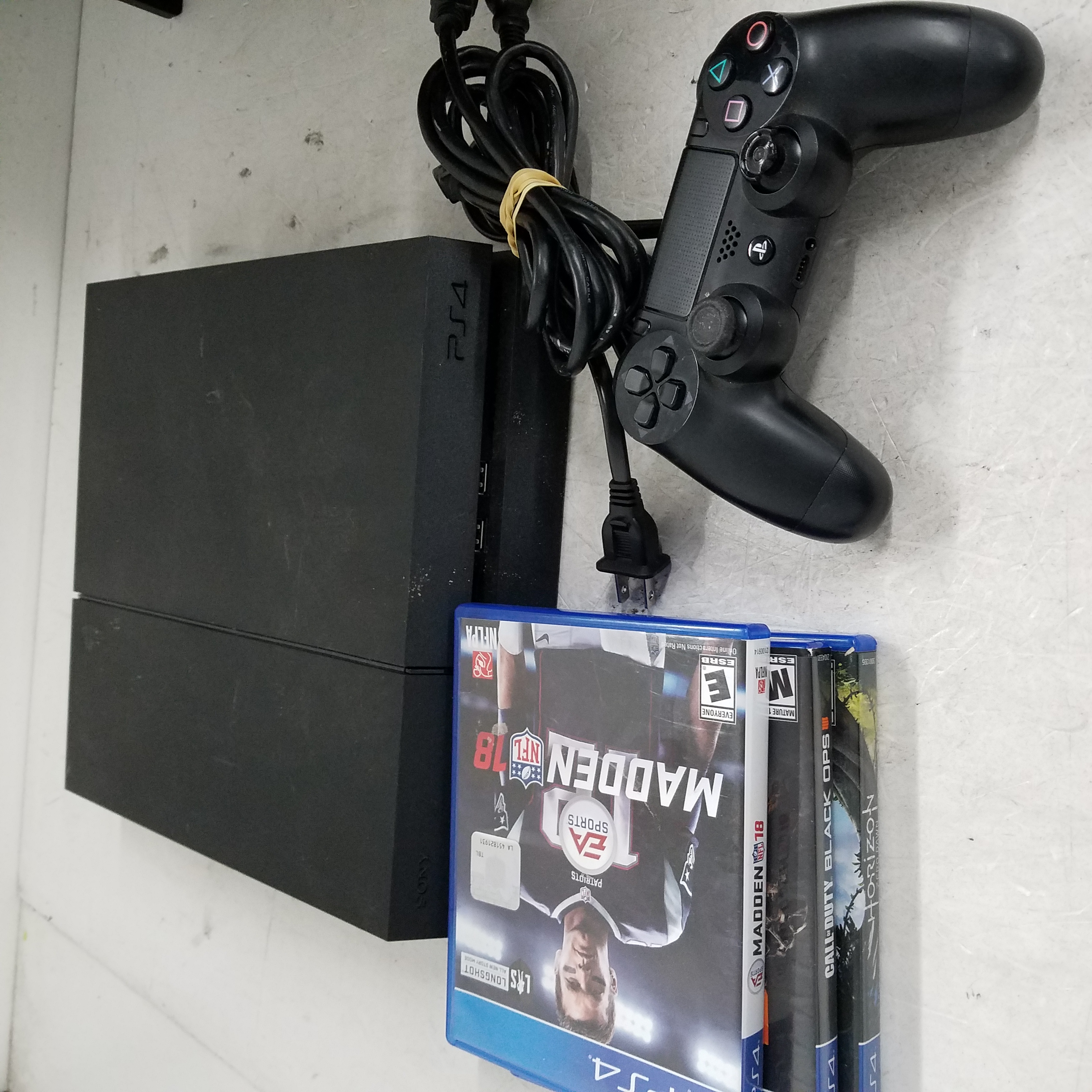 PlayStation Pro With Madden 20, Uncharted, And Accessories