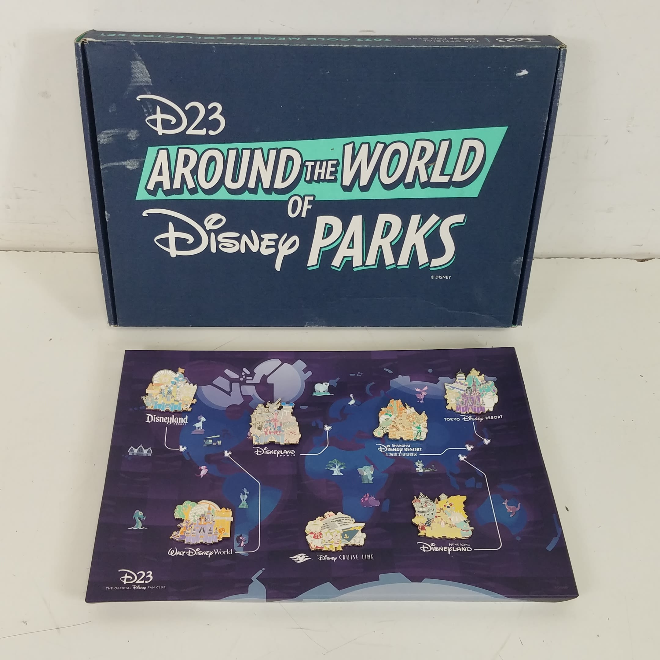 Buy the D23 Around the World of Disney Parks Pin & Passport Set