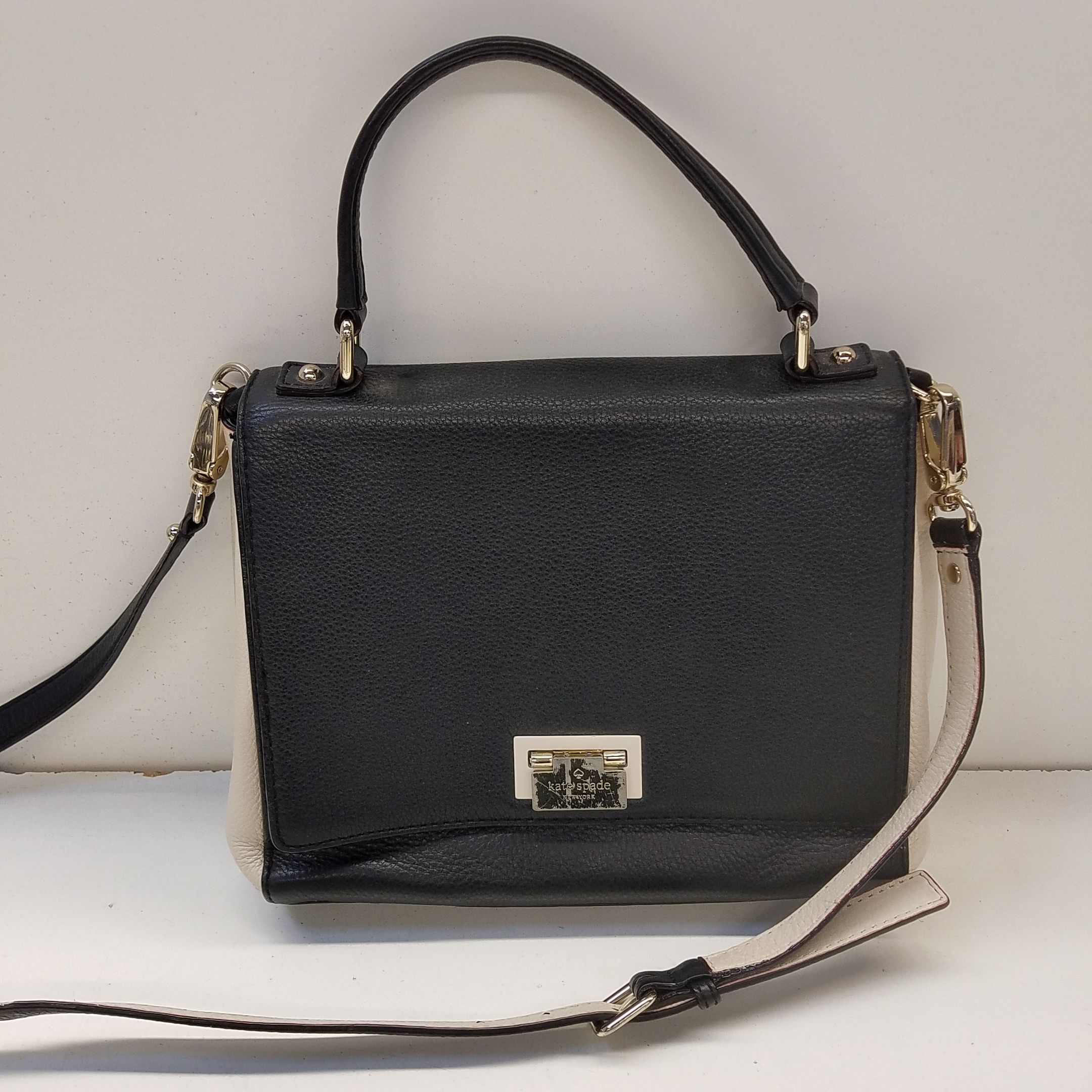 Buy the Kate Spade Pebble Leather Satchel Black White | GoodwillFinds