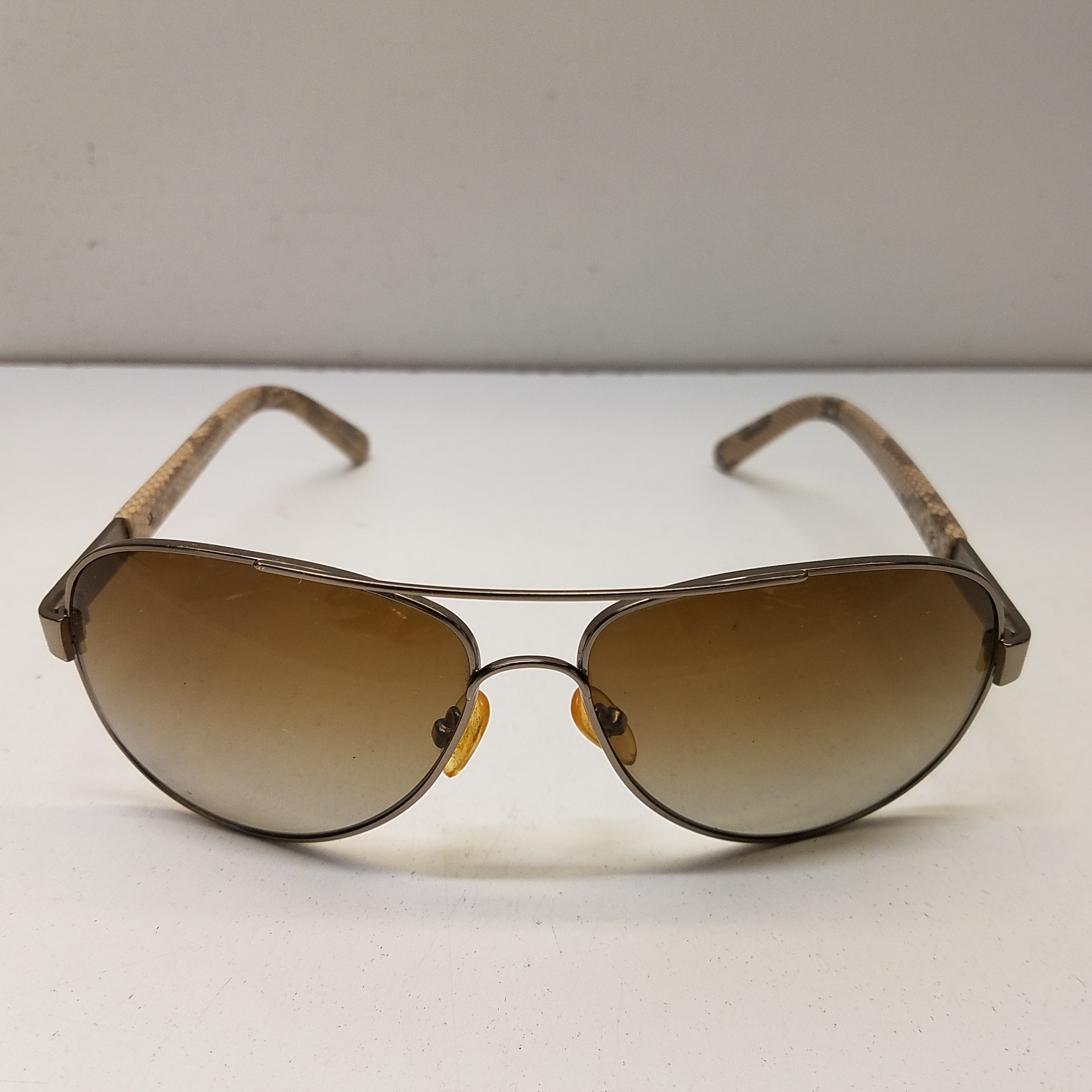 Buy the Tory Burch Silver Snake Aviator Sunglasses | GoodwillFinds