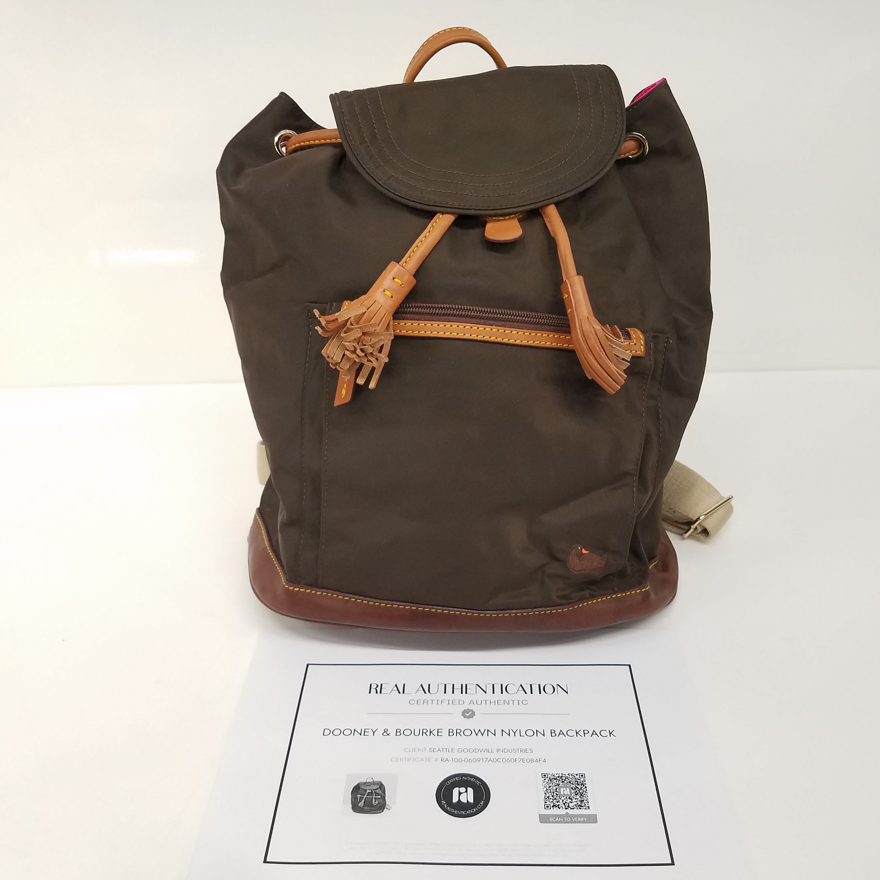 Buy the Dooney Bourke Brown Nylon Drawstring Backpack