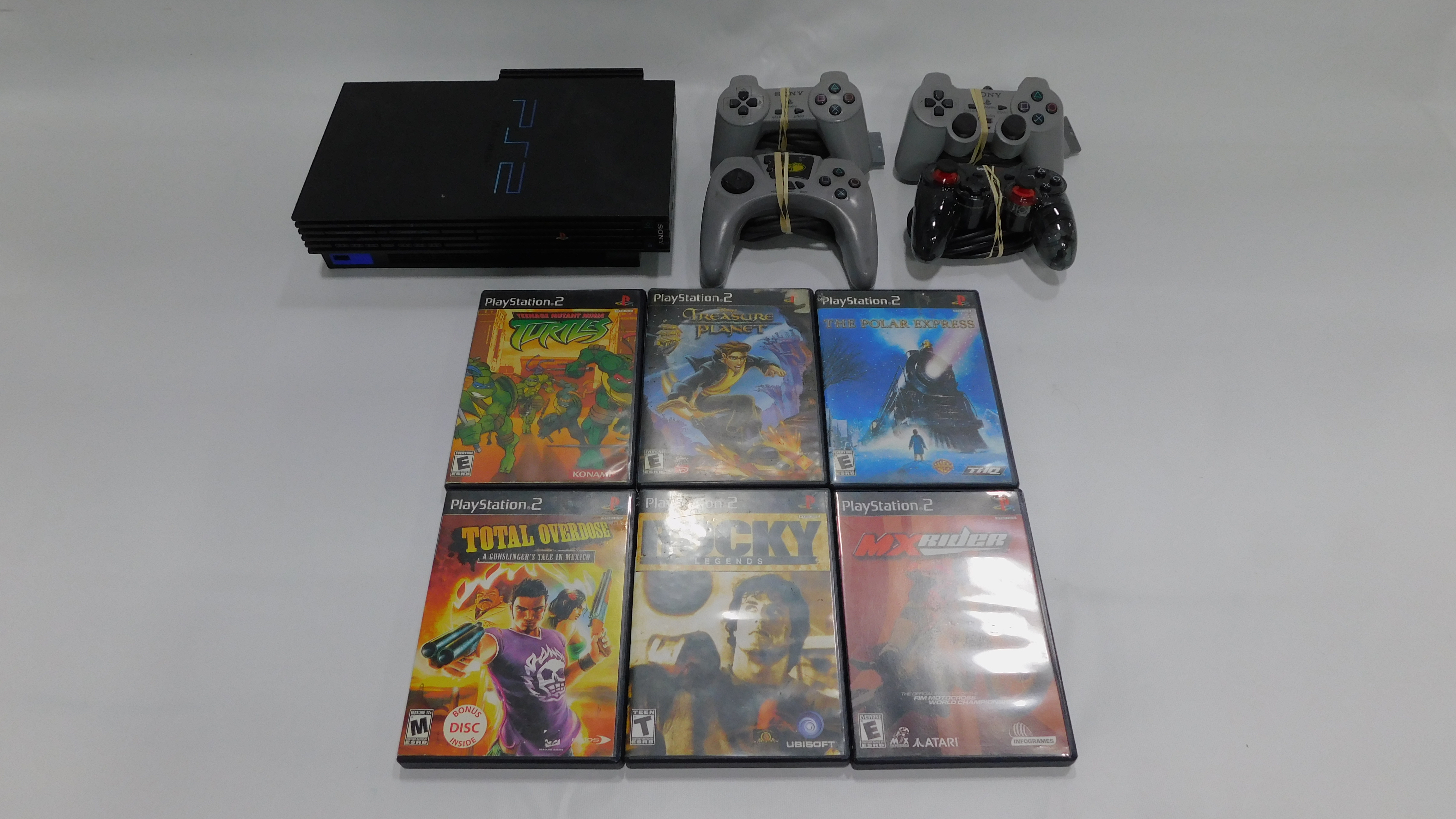 Buy the Sony PlayStation 2 PS2 w/ 6 games Total Overdose | GoodwillFinds