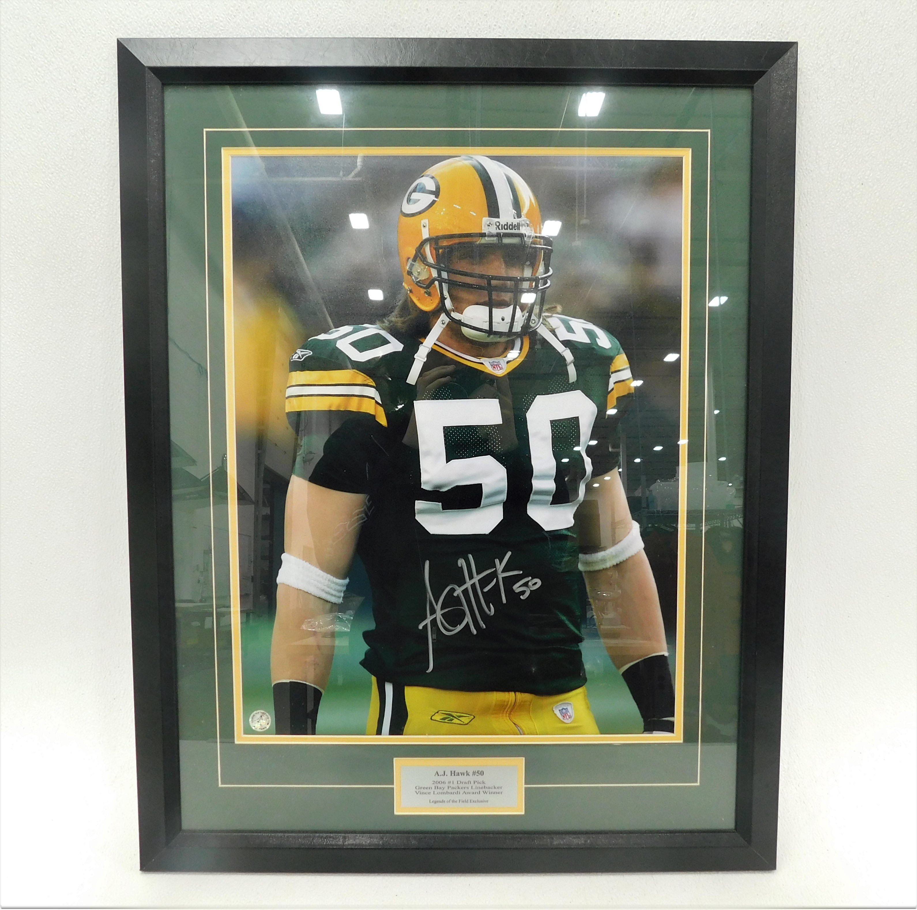 GREEN BAY PACKER AJ HAWK SIGNED AUTO UNDER ARMOUR CLEAT