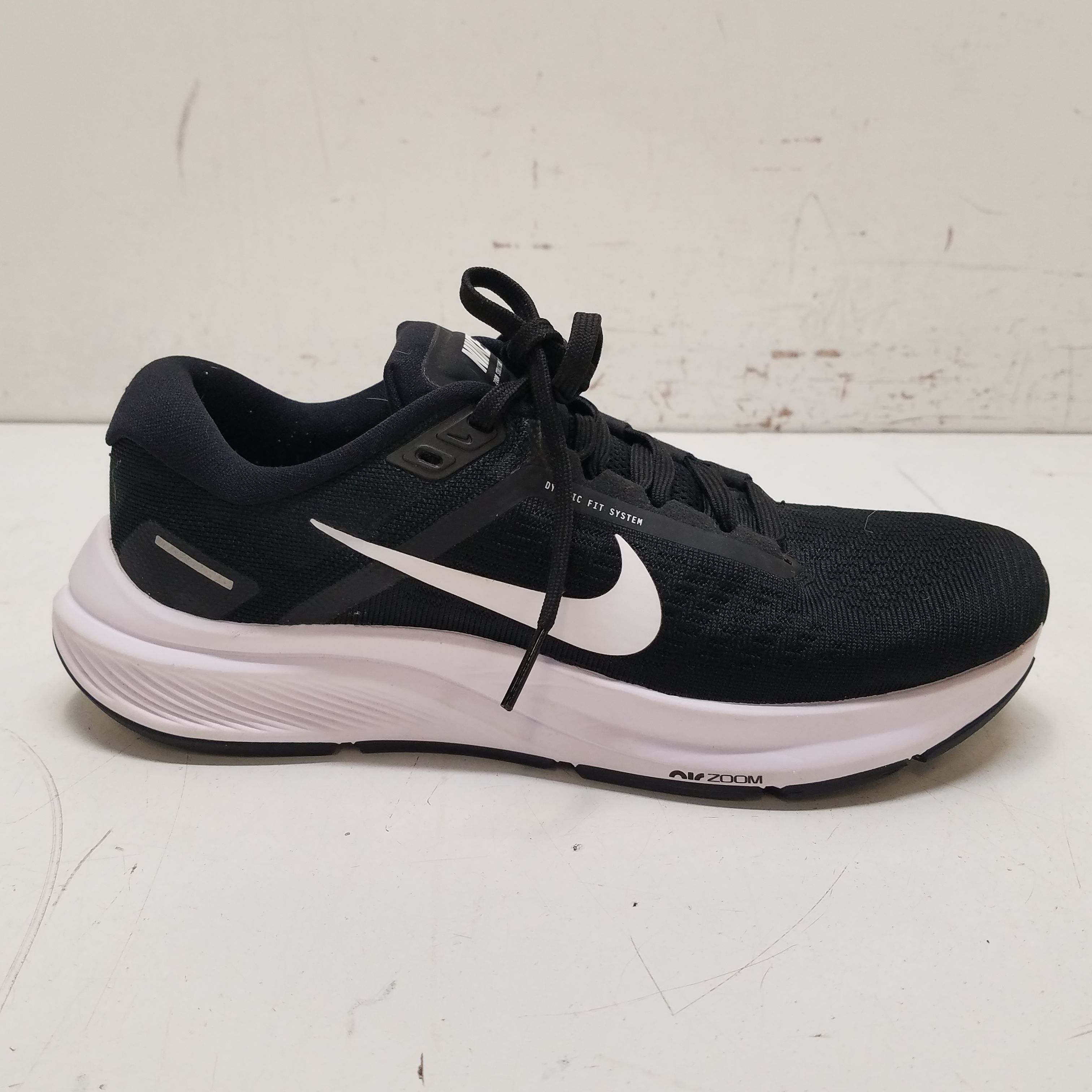 Buy the Nike Air Zoom Structure 24 Black, White Sneakers DA8570-001 ...