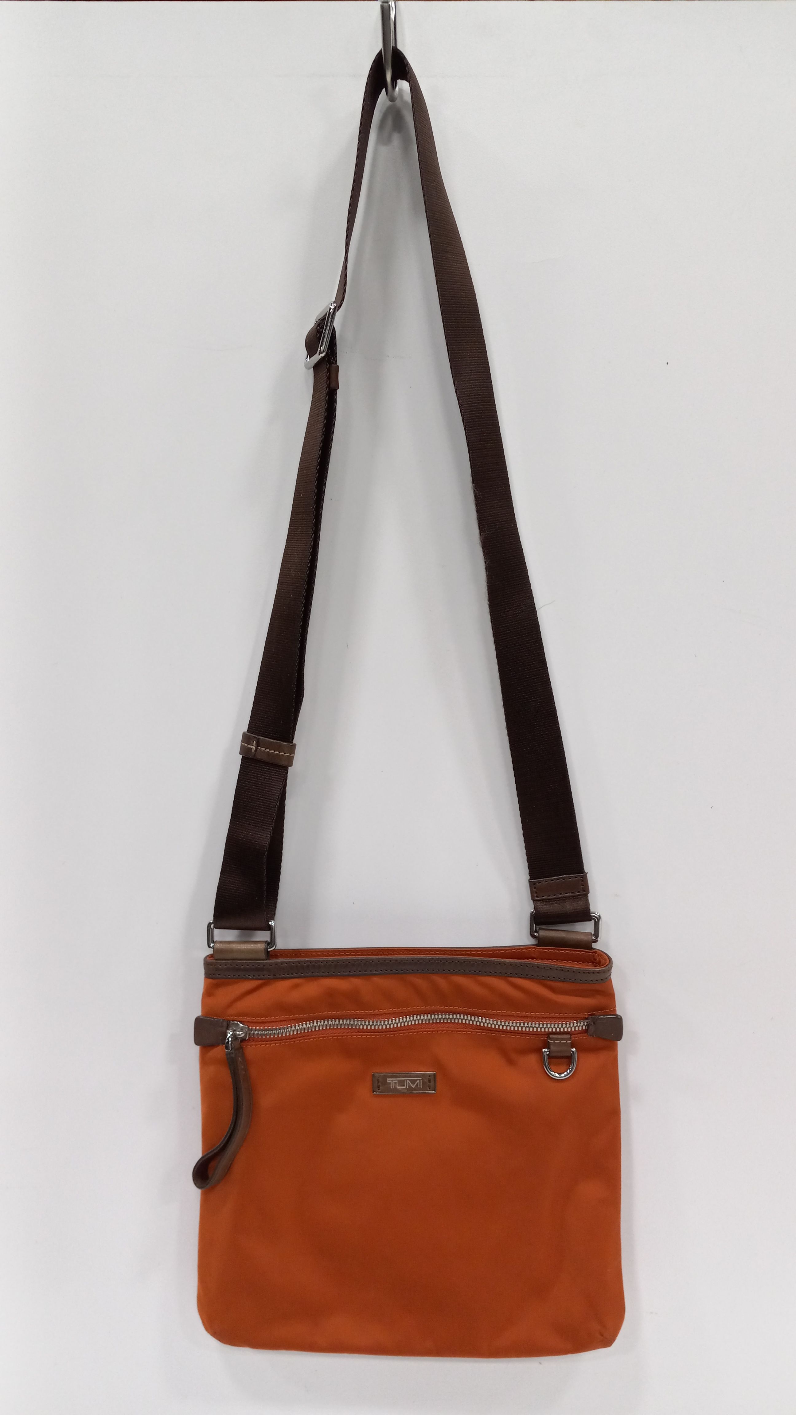 Buy the Tumi Adjustable Strap Women s Orange Crossbody Bag